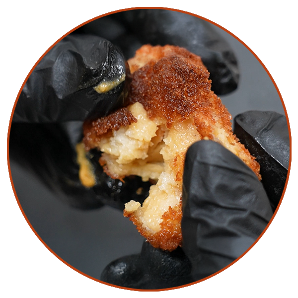 Croqueta casera Miss Croquette abierta mostrando su interior cremoso.